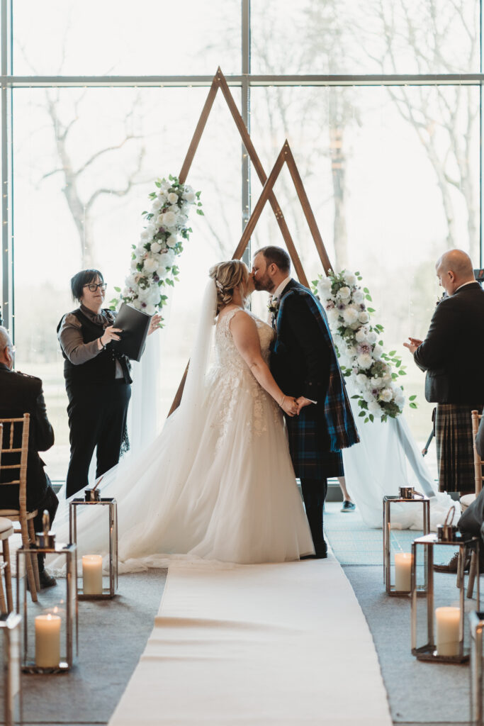 Aberdeenshire bride and groom first kiss at meldrum house, aberdeenshire 