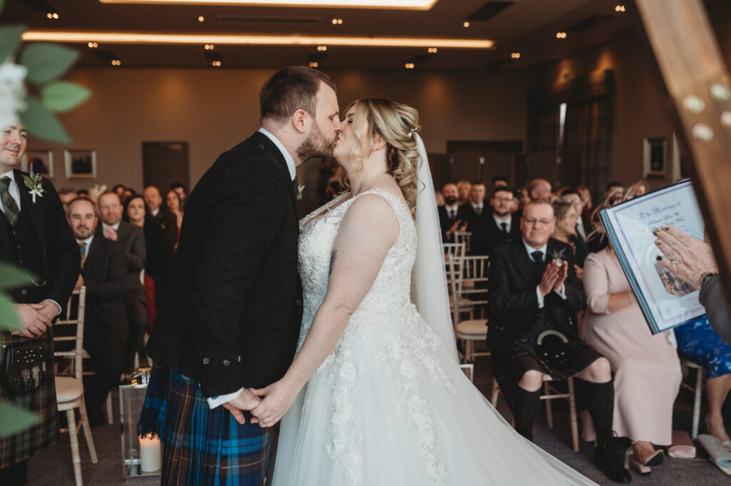 Aberdeenshire bride and groom first kiss at meldrum house, aberdeenshire 