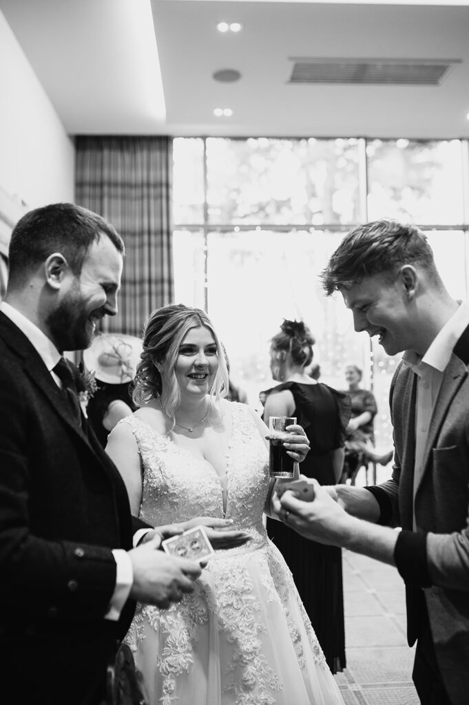 magician performing during cocktail hour at meldrum house, aberdeenshire 