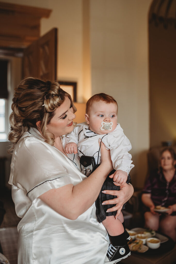 Aberdeenshire bride holds son on wedding day at Meldrum House