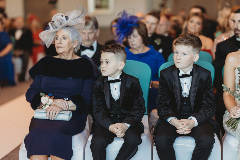 Family of the couple photographed by aberdeenshire wedding photographer during wedding ceremony at meldrum house