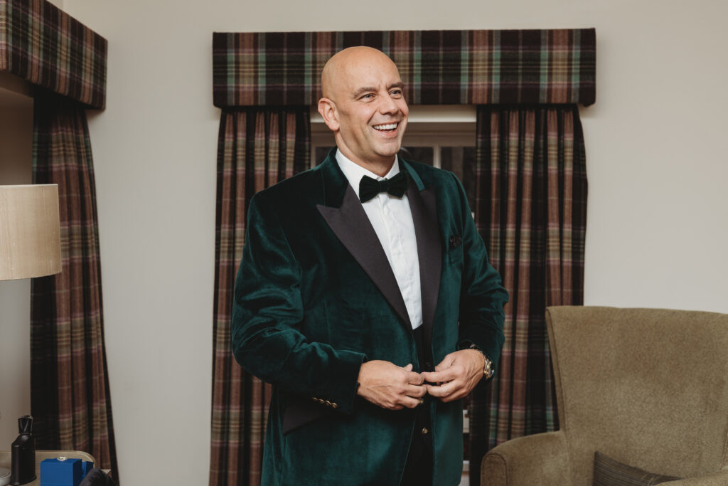 Groom getting ready at meldrum house aberdeenshire