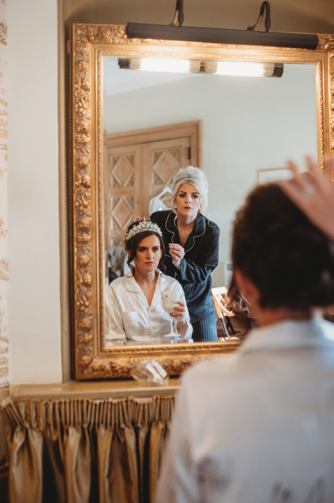 Bride getting her hair done at meldrum house aberdeenshire
