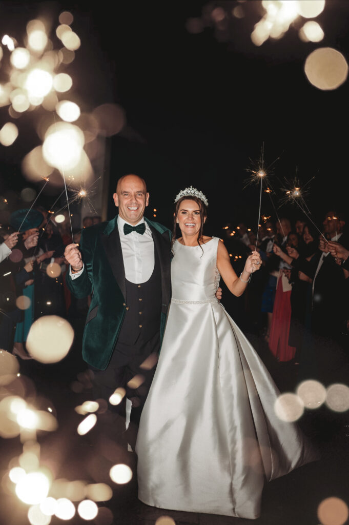 Aberdeenshire couple photographed during a sparkler send-off by an aberdeenshire wedding photographer at meldrum house