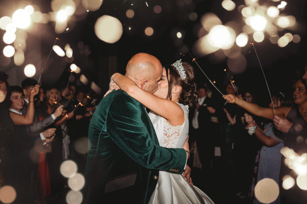 Aberdeenshire couple photographed during a sparkler send-off by an aberdeenshire wedding photographer at meldrum house