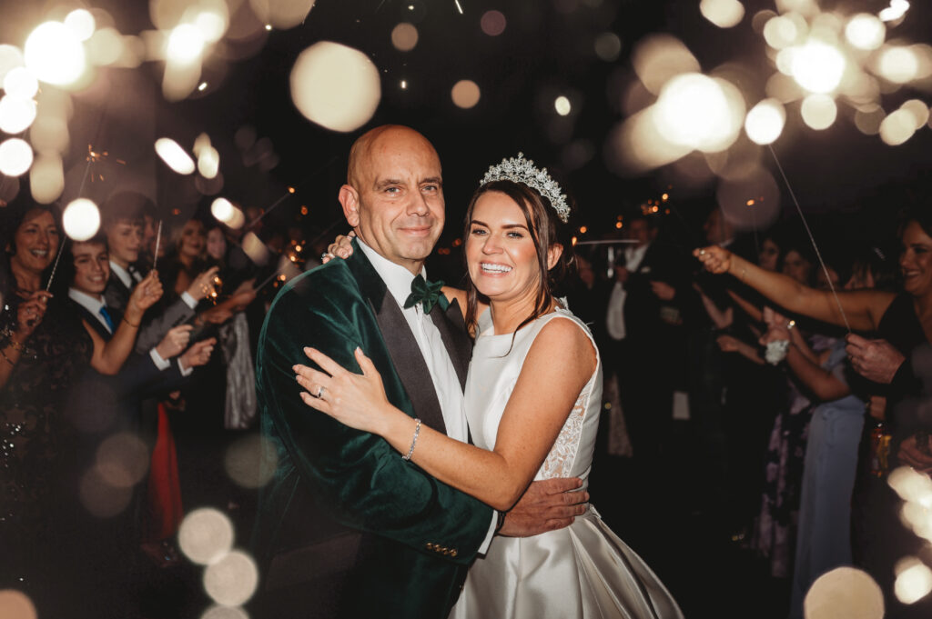 Aberdeenshire couple photographed during a sparkler send-off by an aberdeenshire wedding photographer at meldrum house
