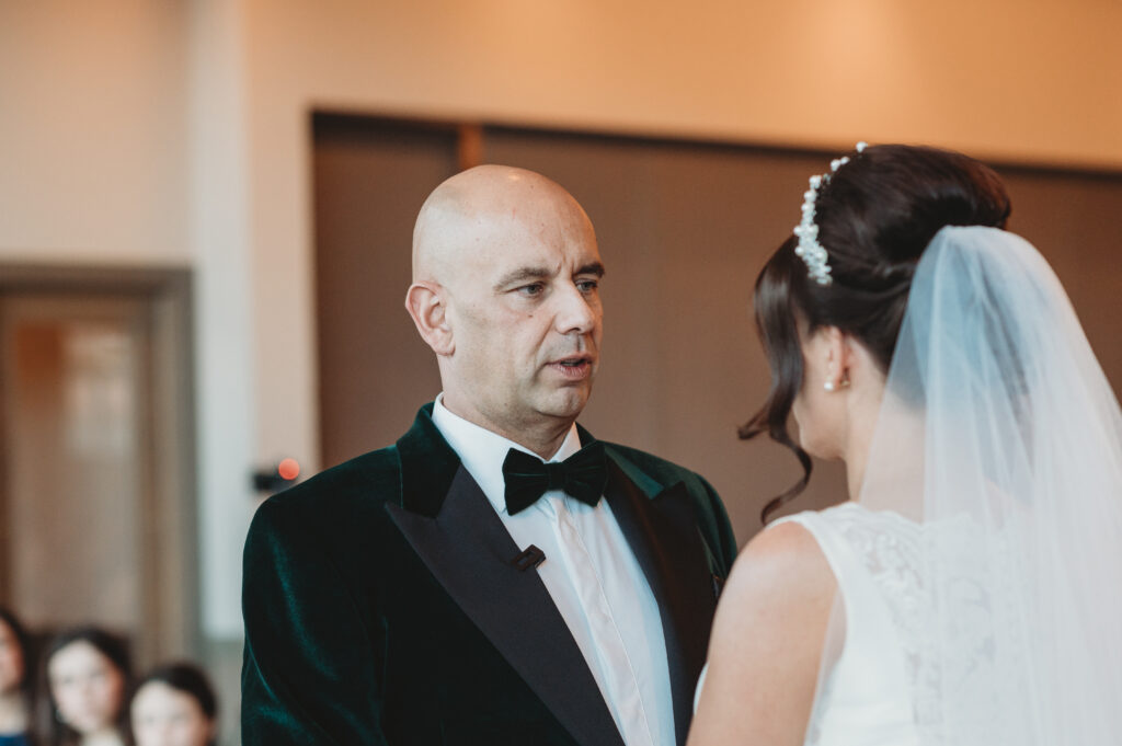 Groom at meldrum house exchanging vows