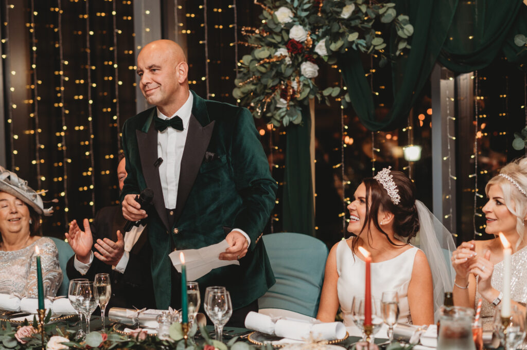 Groom delivers speech during wedding reception at meldrum house aberdeenshire