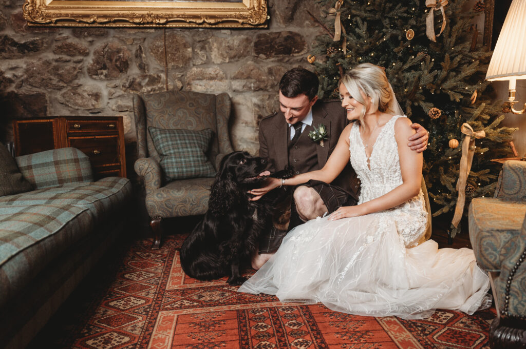 Aberdeenshire couple poses with their dog at their Maryculter House wedding