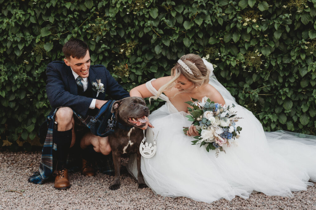 Aberdeenshire couple poses with their dog at their Elsick House wedding