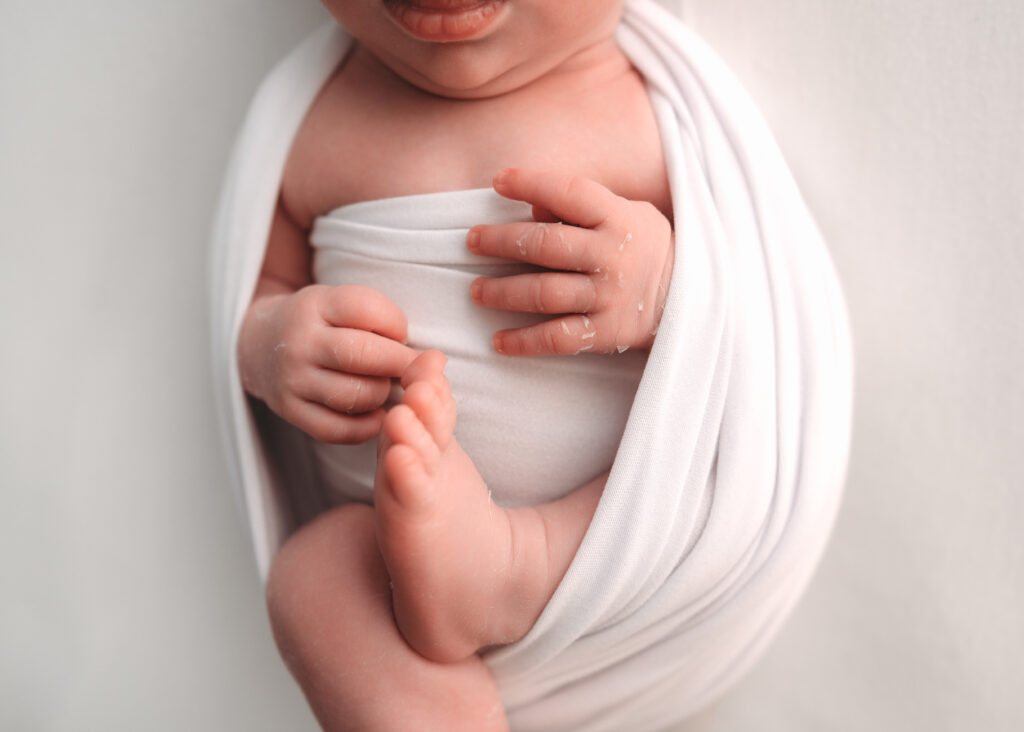 Close-up shot of the baby's body during a newborn session in Aberdeenshire