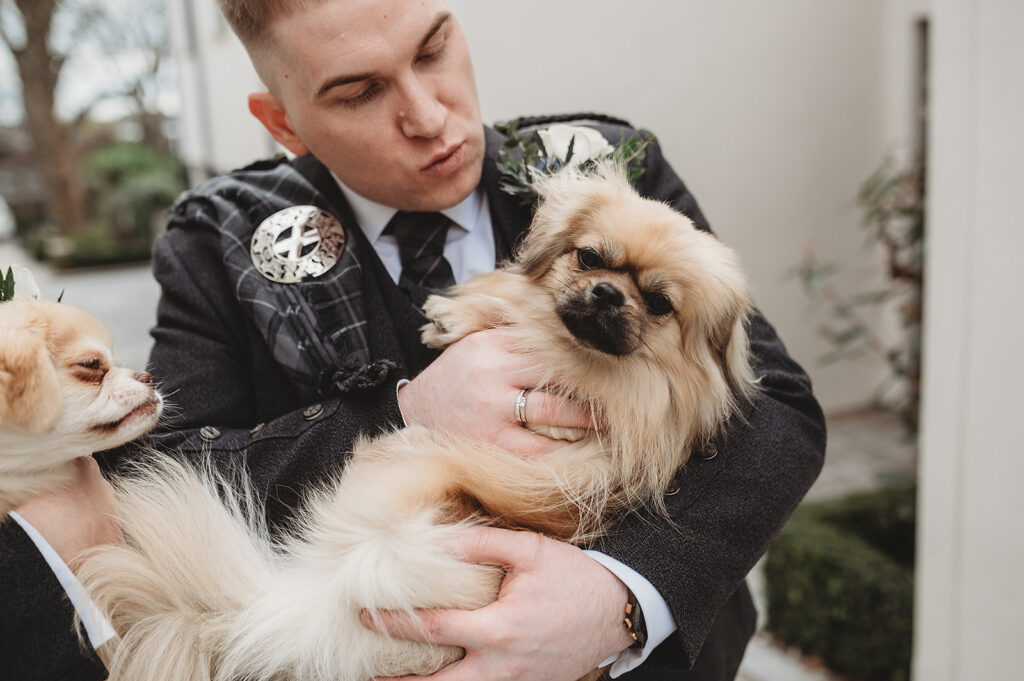 Aberdeenshire couple poses with their dog at their Chester Hotel wedding
